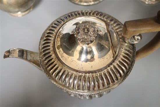 A silver milk jug and sugar bowl and a plated teapot and matching hot water jug,